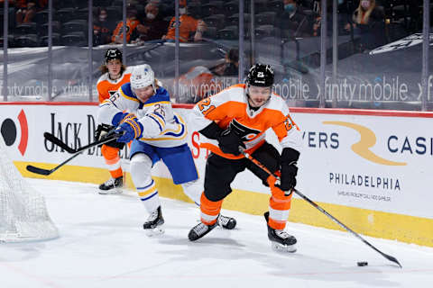 PHILADELPHIA, PENNSYLVANIA – MARCH 09: Scott Laughton #21 of the Philadelphia Flyers chases the puck during the third period against the Buffalo Sabres at Wells Fargo Center on March 09, 2021 in Philadelphia, Pennsylvania. (Photo by Tim Nwachukwu/Getty Images)