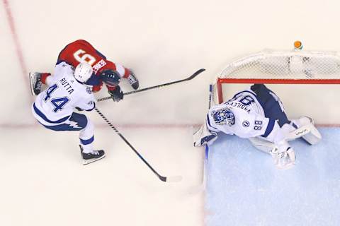 SUNRISE, FL – MAY 17: Jan Rutta #44 of the Tampa Bay Lightning ties up Sam Bennett #9 of the Florida Panthers at the right side of goaltender Andrei Vasilevskiy #88 in Game One of the Second Round of the 2022 NHL Stanley Cup Playoffs at the FLA Live Arena on May 17, 2022 in Sunrise, Florida. The Lightning defeated the Panthers 4-1. (Photo by Joel Auerbach/Getty Images)