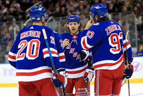 New York Rangers left wing Artemi Panarin (10) talks with left wing Chris Kreider (20) and center Mika Zibanejad (93) Credit: Danny Wild-USA TODAY Sports