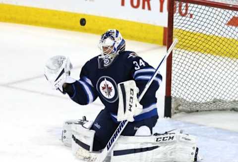 Vegas Golden Knights: Winnipeg Jets goalie Michael Hutchinson (34) makes a save prior to the game between the Winnipeg Jets and the Boston Bruins at MTS Centre. Mandatory Credit: Bruce Fedyck-USA TODAY Sports