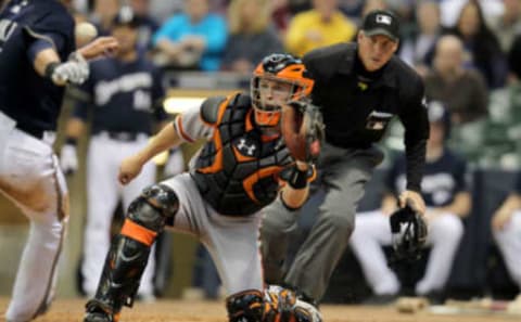 MILWAUKEE, WI – MAY 22: Buster Posey #28 of the San Francisco Giants makes an outstanding play at the home plate to tag out Norichika Aoki #7 of the Milwaukee Brewers during the game at Miller Park on May 22, 2012 in Milwaukee, Wisconsin. (Photo by Mike McGinnis/Getty Images)