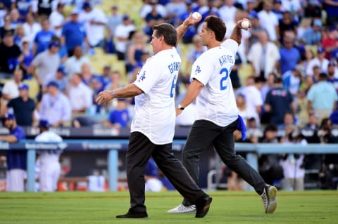 LOS ANGELES, CA – OCTOBER 20: Former Los Angeles Dodgers Steve Garvey and Eric Karros make the ceremonial first pitch before game five of the National League Division Series at Dodger Stadium on October 20, 2016 in Los Angeles, California. (Photo by Harry How/Getty Images)