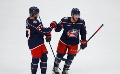 Sep 25, 2022; Columbus, Ohio, USA; Columbus Blue Jackets right wing Justin Danforth (17) celebrates his second goal with defenseman Adam Boqvist (27) during the third period against the Pittsburgh Penguins at Nationwide Arena. Mandatory Credit: Joseph Maiorana-USA TODAY Sports