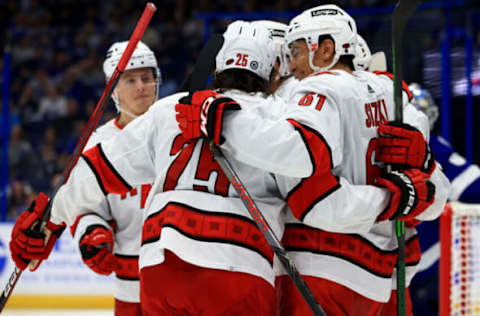 TAMPA, FLORIDA – OCTOBER 01: Ryan Suzuki #61 of the Carolina Hurricanes celebrates a goal during a preseason game against the Tampa Bay Lightning at Amalie Arena on October 01, 2021, in Tampa, Florida. (Photo by Mike Ehrmann/Getty Images)