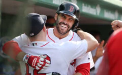 BOSTON – JUNE 9: Boston Red Sox player J.D Martinez celebrates in the dugout with teammate Brock Holt after hitting a two-run home run during the fifth inning. The Boston Red Sox host the Chicago White Sox in a regular season MLB baseball game at Fenway Park in Boston on June 9, 2018. (Photo by Matthew J. Lee/The Boston Globe via Getty Images)