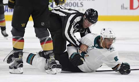 LAS VEGAS, NEVADA – SEPTEMBER 29: Linesman Kiel Murchison lands on Evander Kane #9 of the San Jose Sharks in the third period of the Sharks’ preseason game against the Vegas Golden Knights at T-Mobile Arena on September 29, 2019 in Las Vegas, Nevada. Kane received a game misconduct for an abuse of officials penalty. The Golden Knights defeated the Sharks 5-1. (Photo by Ethan Miller/Getty Images)