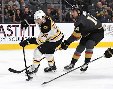 LAS VEGAS, NEVADA – OCTOBER 08: Jake DeBrusk #74 of the Boston Bruins skates with the puck against Nicolas Hague #14 Vegas Golden Knights in the third period of their game at T-Mobile Arena on October 8, 2019 in Las Vegas, Nevada. The Bruins defeated the Golden Knights 4-3. (Photo by Ethan Miller/Getty Images)