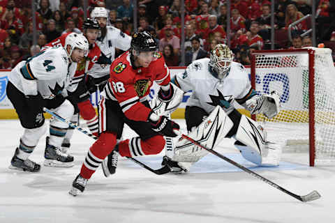 CHICAGO, IL – OCTOBER 10: Patrick Kane #88 of the Chicago Blackhawks and Marc-Edouard Vlasic #44 of the San Jose Sharks watch for the puck next to goalie Aaron Dell #30 in the third period at the United Center on October 10, 2019 in Chicago, Illinois. (Photo by Bill Smith/NHLI via Getty Images)