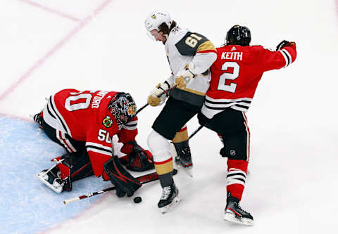 Corey Crawford #50 and Duncan Keith #2 of the Chicago Blackhawks defend against Mark Stone #61 of the Vegas Golden Knights during the third period in Game Three of the Western Conference First Round. (Photo by Jeff Vinnick/Getty Images)