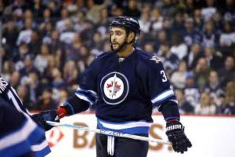 Jan 26, 2016; Winnipeg, Manitoba, CAN; Winnipeg Jets defenseman Dustin Byfuglien (33) during the third period against the Arizona Coyotes at MTS Centre. Winnipeg wins 5-2. Mandatory Credit: Bruce Fedyck-USA TODAY Sports