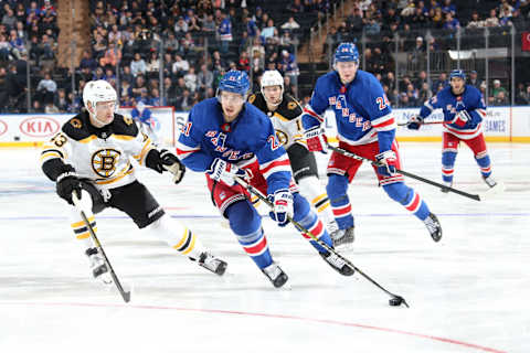 NEW YORK, NY – OCTOBER 27: Brett Howden #21 of the New York Rangers skates with the puck against Danton Heinen #43 of the Boston Bruins at Madison Square Garden on October 27, 2019 in New York City. (Photo by Jared Silber/NHLI via Getty Images)