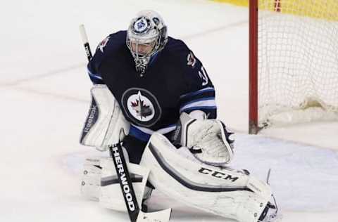 Mar 24, 2016; Winnipeg, Manitoba, CAN; Winnipeg Jets goaltender Ondrej Pavelec (31) watches the puck against the Los Angeles Kings at MTS Centre. Winnipeg beat Los Angeles 4-1. Mandatory Credit: Ray Peters-USA TODAY Sports