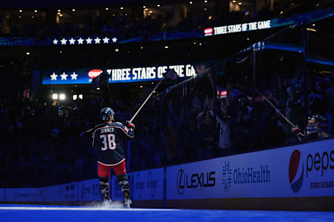 Apr 2, 2023; Columbus, Ohio, USA; 1st Star of the game Columbus Blue Jackets center Boone Jenner (38) hands a stick over the glass against the Ottawa Senators at Nationwide Arena. Mandatory Credit: Jason Mowry-USA TODAY Sports