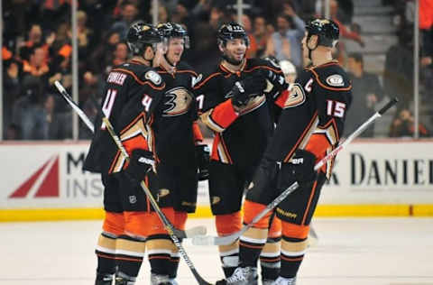 February 27, 2015; Anaheim, CA, USA; Anaheim Ducks right wing Corey Perry (10) celebrates his goal scored with defenseman Cam Fowler (4), center Ryan Kesler (17) and center Ryan Getzlaf (15) against the Los Angeles Kings during the third period at Honda Center. Mandatory Credit: Gary A. Vasquez-USA TODAY Sports