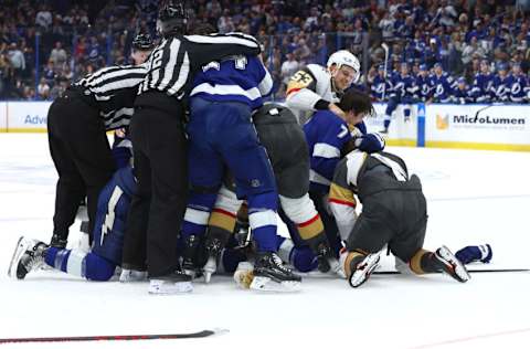 Mar 9, 2023; Tampa, Florida, USA; Vegas Golden Knights center Teddy Blueger (53), Tampa Bay Lightning defenseman Haydn Fleury (7) and teammates fight during the third period at Amalie Arena. Mandatory Credit: Kim Klement-USA TODAY Sports