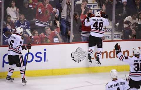 Nov 19, 2016; Vancouver, British Columbia, CAN; Chicago Blackhawks forward Vinnie Hinostroza (48) celebrates after scoring a goal against Vancouver Canucks goaltender Jacob Markstrom (not pictured) during the third period at Rogers Arena. The Chicago Blackhawks won 4-3 in overtime. Mandatory Credit: Anne-Marie Sorvin-USA TODAY Sports