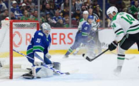 VANCOUVER, CANADA – MARCH 14: Thatcher Demko #35 of the Vancouver Canucks makes a save on a shot by Jamie Benn #14 of the Dallas Stars during the second period at Rogers Arena on March 14, 2023 in Vancouver, British Columbia, Canada. (Photo by Derek Cain/Getty Images)