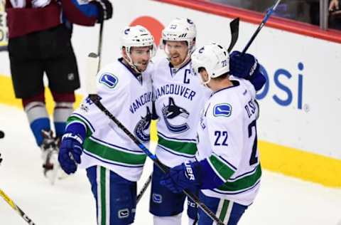 NHL Power Rankings: Vancouver Canucks left wing Sven Baertschi (47) celebrates his go ahead goal with center Henrik Sedin (33) and left wing Daniel Sedin (22) in the third period against the Colorado Avalanche at the Pepsi Center. The Canucks defeated the Avalanche 3-2. Mandatory Credit: Ron Chenoy-USA TODAY Sports