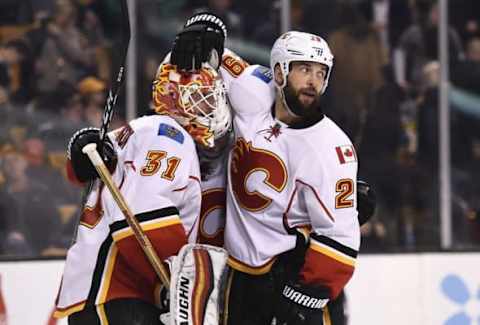 Nov 25, 2016; Boston, MA, USA; Calgary Flames goalie Chad Johnson (31) celebrates with defenseman Deryk Engelland (29) after defeating the Boston Bruins at TD Garden. Mandatory Credit: Bob DeChiara-USA TODAY Sports