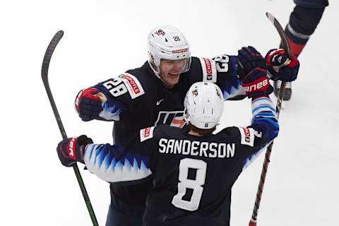 Arthur Kaliyev #28 and Jake Sanderson #8 of the United States (Photo by Codie McLachlan/Getty Images)