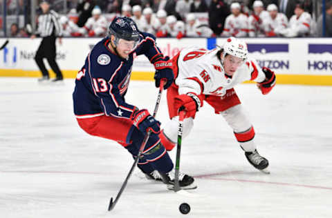 COLUMBUS, OH – JANUARY 16: Cam Atkinson #13 of the Columbus Blue Jackets battles for the puck with Erik Haula #56 of the Carolina Hurricanes during the third period of a game on January 16, 2020 at Nationwide Arena in Columbus, Ohio. (Photo by Jamie Sabau/NHLI via Getty Images)