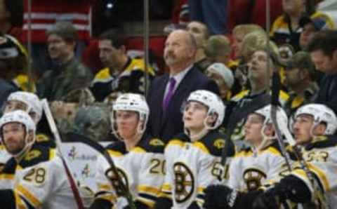 Dec 23, 2016; Raleigh, NC, USA; Boston Bruins head coach Claude Julien looks up after a Carolina Hurricanes goal during the third period at PNC Arena. The Carolina Hurricanes defeated the Boston Bruins 3-2 in overtime. Mandatory Credit: James Guillory-USA TODAY Sports