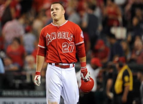 September 30, 2015; Anaheim, CA, USA; Los Angeles Angels center fielder Mike Trout (27) reacts following the 8-7 loss against the Oakland Athletics at Angel Stadium of Anaheim. Mandatory Credit: Gary A. Vasquez-USA TODAY Sports