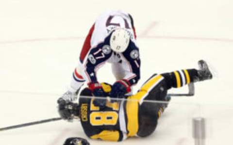 Feb 3, 2017; Pittsburgh, PA, USA; Columbus Blue Jackets center Brandon Dubinsky (17) checks Pittsburgh Penguins center Sidney Crosby (87). Mandatory Credit: Charles LeClaire-USA TODAY Sports