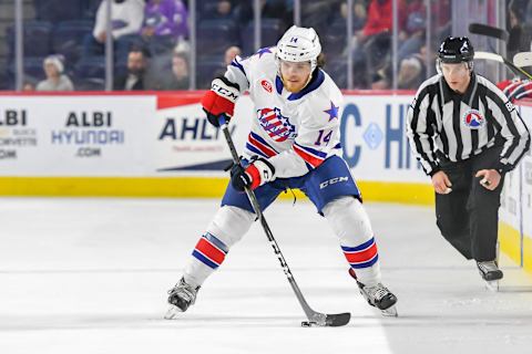 LAVAL, QC, CANADA – JANUARY 5: Sean Malone #14 of the Rochester Americans in control of the puck against the Laval Rocket at Place Bell on January 5, 2019 in Laval, Quebec. (Photo by Stephane Dube /Getty Images)