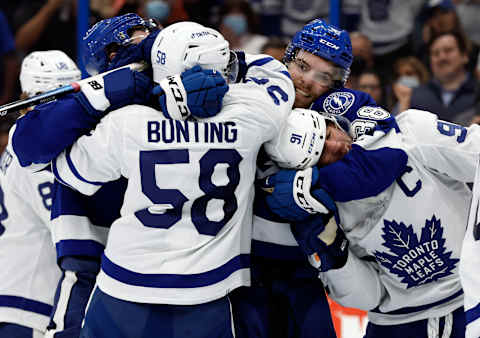 Apr 21, 2022; Tampa, Florida, USA; Toronto Maple Leafs center John Tavares (91), left wing Michael Bunting (58),  Mandatory Credit: Kim Klement-USA TODAY Sports