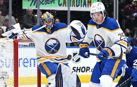 Apr 12, 2022; Toronto, Ontario, CAN; Buffalo Sabres goalie Craig Anderson (41) and defenseman Owen Power (25) watch a loose puck bouncing in the goal area in the third period against the Toronto Maple Leafs at Scotiabank Arena. Mandatory Credit: Dan Hamilton-USA TODAY Sports