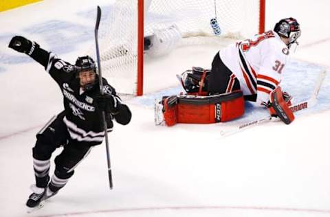 Apr 9, 2015; Boston, MA, USA; Providence College Friars forward Mark Jankowski (10) celebrates his goal on Nebraska-Omaha Mavericks goaltender Ryan Masa (31) during the second period of a semifinal game in the men