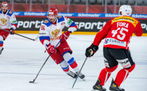 BIEL, SWITZERLAND – APRIL 30: Kirill Marchenko of Russia battles for the puck with Michael Fora of Switzerland during the Ice Hockey International Friendly game between Switzerland and Russia at Tissot-Arena on April 30, 2021 in Biel, Switzerland. (Photo by RvS.Media/Robert Hradil/Getty Images)