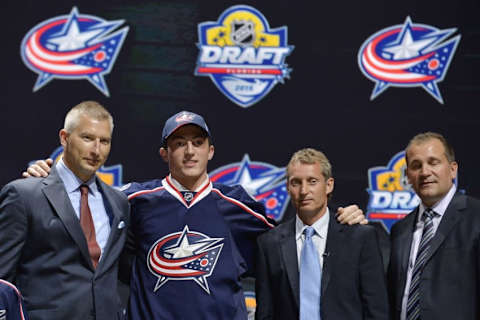 Jun 26, 2015; Sunrise, FL, USA; Zachary Werenski poses for a photo with team executives after being selected as the number eight overall pick to the Columbus Blue Jackets in the first round of the 2015 NHL Draft at BB&T Center. Mandatory Credit: Steve Mitchell-USA TODAY Sports