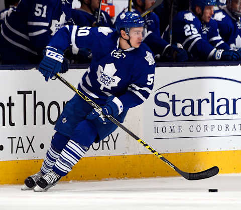 TORONTO, ON – FEBRUARY 25: Stuart Percy #50 of the Toronto Maple Leafs carries the puck up ice against the Carolina Hurricanes during game action on February 25, 2016 at Air Canada Centre in Toronto, Ontario, Canada. (Photo by Graig Abel/NHLI via Getty Images)