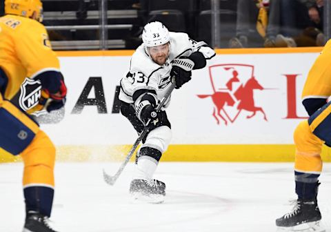 Oct 18, 2022; Nashville, Tennessee, USA; Los Angeles Kings left wing Viktor Arvidsson (33) passes the puck during the second period against the Nashville Predators at Bridgestone Arena. Mandatory Credit: Christopher Hanewinckel-USA TODAY Sports