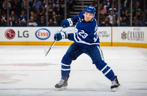 TORONTO, ON – MARCH 28: Travis Dermott #23 of the Toronto Maple Leafs shoots against the Florida Panthers during the second period at the Air Canada Centre on March 28, 2018 in Toronto, Ontario, Canada. (Photo by Kevin Sousa/NHLI via Getty Images)