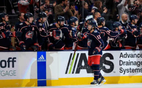 Oct 20, 2022; Columbus, Ohio, USA; Columbus Blue Jackets left wing Johnny Gaudreau (13) celebrates with teammates on the bench after scoring a goal against the Nashville Predators in the third period at Nationwide Arena. Mandatory Credit: Aaron Doster-USA TODAY Sports