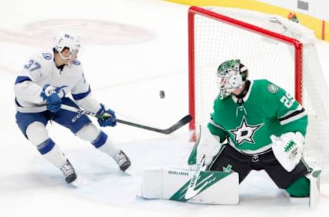 DALLAS, TEXAS – MARCH 25: Jake Oettinger #29 of the Dallas Stars blocks a shot on goal against Yanni Gourde #37 of the Tampa Bay Lightning in the first period at American Airlines Center on March 25, 2021 in Dallas, Texas. (Photo by Tom Pennington/Getty Images)