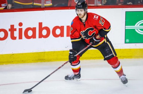 Apr 19, 2017; Calgary, Alberta, CAN; Calgary Flames defenseman Dougie Hamilton (27) controls the puck against the Anaheim Ducks during the third period in game four of the first round of the 2017 Stanley Cup Playoffs at Scotiabank Saddledome. Anaheim Ducks won 3-1. Mandatory Credit: Sergei Belski-USA TODAY Sports