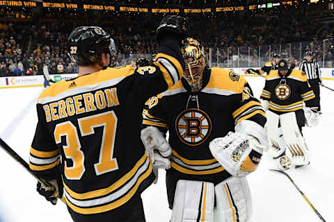 BOSTON, MA – DECEMBER 23: Patrice Bergeron #37 and Tuukka Rask #40 of the Boston Bruins celebrate the win against the Washington Capitals at the TD Garden on December 23, 2019 in Boston, Massachusetts. (Photo by Steve Babineau/NHLI via Getty Images)