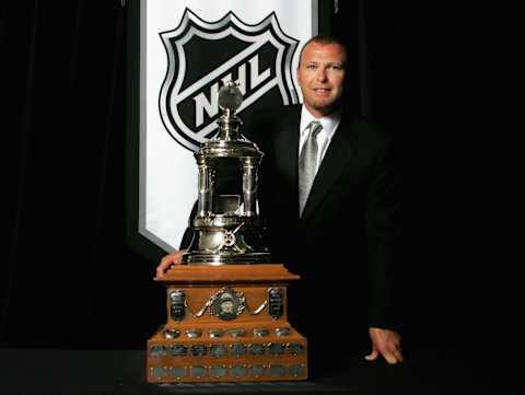 Martin Brodeur of the New Jersey Devils poses with the Vezina Trophy. (Photo by Bruce Bennett/Getty Images)