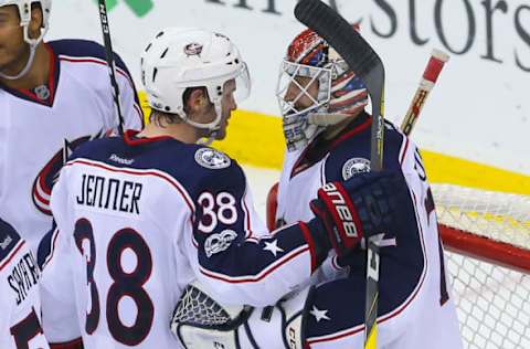 Mar 19, 2017; Newark, NJ, USA; Columbus Blue Jackets center Boone Jenner (38) and goalie Sergei Bobrovsky celebrates the Blue Jackets 4-1 win over the New Jersey Devils (72) at Prudential Center. Mandatory Credit: Ed Mulholland-USA TODAY Sports