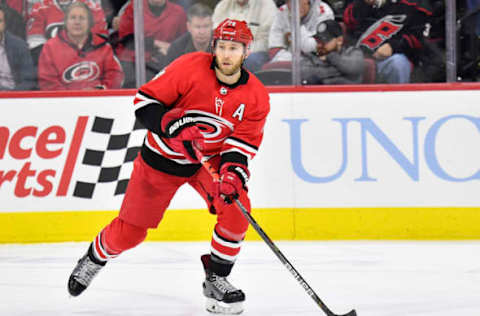 RALEIGH, NORTH CAROLINA – FEBRUARY 16: Jaccob Slavin #74 of the Carolina Hurricanes moves the puck against the Edmonton Oilers during the second period at PNC Arena on February 16, 2020 in Raleigh, North Carolina. The Oilers won 4-3 in overtime. (Photo by Grant Halverson/Getty Images)