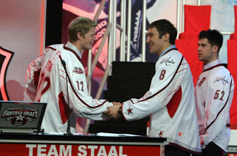 RALEIGH, NC – JANUARY 28: Third pick Alex Ovechkin of the Washington Capitals for team Staal is greeted by Eric Staal (L) of the Carolina Hurricanes as Mike Green (R) of the Washington Capitals looks on during the All-Star Fantasy Draft for the 2011 NHL All-Star Weekend at the Raleigh Convention Center on January 28, 2011 in Raleigh, North Carolina. (Photo by Dave Sandford/NHLI via Getty Images)