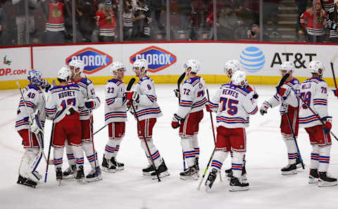 CHICAGO, ILLINOIS – DECEMBER 07: Members of the New York Rangers celebrate a win over the Chicago Blackhawks at the United Center on December 07, 2021 in Chicago, Illinois. The Rangers defeated the Blackhawks 6-2. (Photo by Jonathan Daniel/Getty Images)