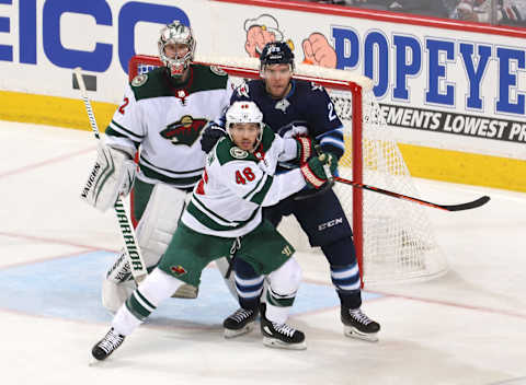 WINNIPEG, MB – APRIL 20: Goaltender Alex Stalock #32, Jared Spurgeon #46 of the Minnesota Wild and Paul Stastny #25 of the Winnipeg Jets keep an eye on the play during second period action in Game Five of the Western Conference First Round during the 2018 NHL Stanley Cup Playoffs at the Bell MTS Place on April 20, 2018 in Winnipeg, Manitoba, Canada. (Photo by Jonathan Kozub/NHLI via Getty Images)