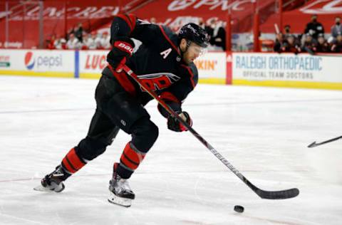 RALEIGH, NORTH CAROLINA – MARCH 04: Jaccob Slavin #74 of the Carolina Hurricanes skates with the puck during the second period of their game against the Detroit Red Wings at PNC Arena on March 04, 2021, in Raleigh, North Carolina. (Photo by Jared C. Tilton/Getty Images)