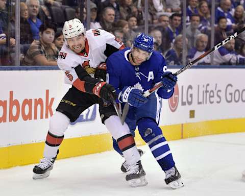 TORONTO, ON – OCTOBER 06: Ottawa Senators Defenceman Cody Ceci (5) collides with Toronto Maple Leafs Center John Tavares (91) during the regular season NHL game between the Ottawa Senators and the Toronto Maple Leafs on October 6, 2018 at Scotiabank Arena in Toronto, ON. (Photo by Jeff Chevrier/Icon Sportswire via Getty Images)