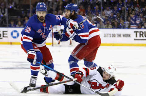 NEW YORK, NEW YORK – APRIL 29: Jack Hughes #86 of the New Jersey Devils is hit by Chris Kreider #20 of the New York Rangers during the first period in Game Six of the First Round of the 2023 Stanley Cup Playoffs at Madison Square Garden on April 29, 2023, in New York, New York. (Photo by Bruce Bennett/Getty Images)